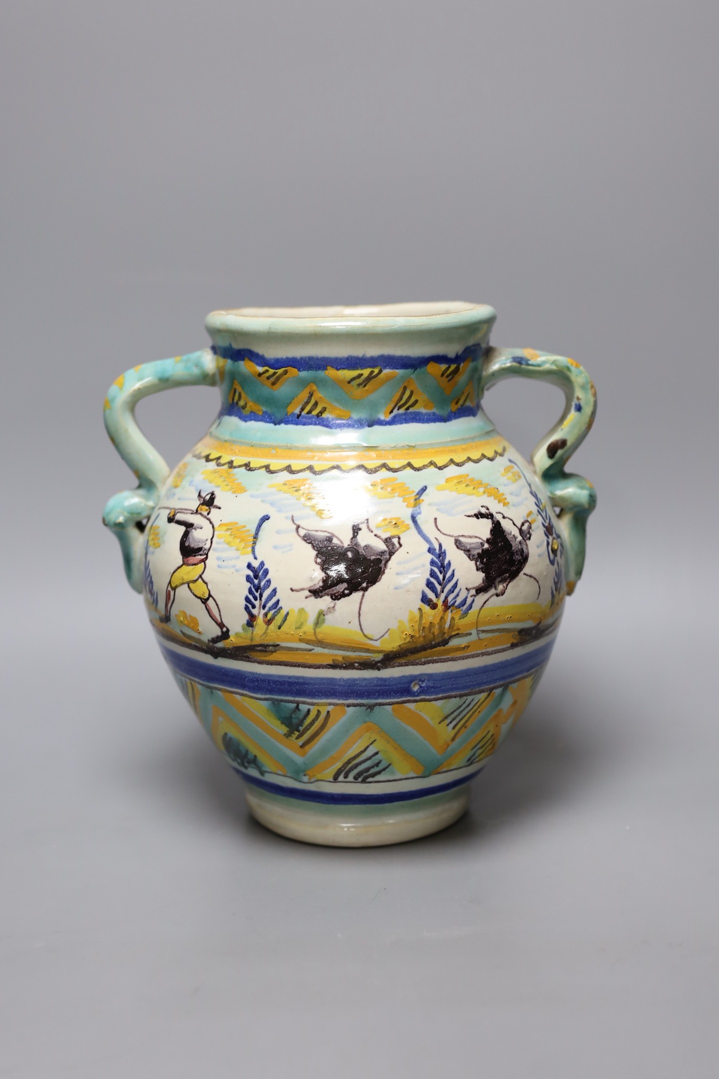 A Italian maiolica vase decorated with hares, 23cm tall